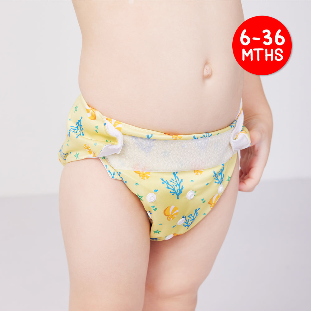 A Kid Wearing the Cheekaaboo's Cotton Cloth Diapers in Coral Design