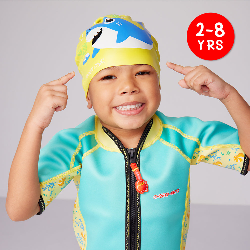 A Kid Wearing the Silicone Water Resistant Swimming Cap in Yellow Shark Design