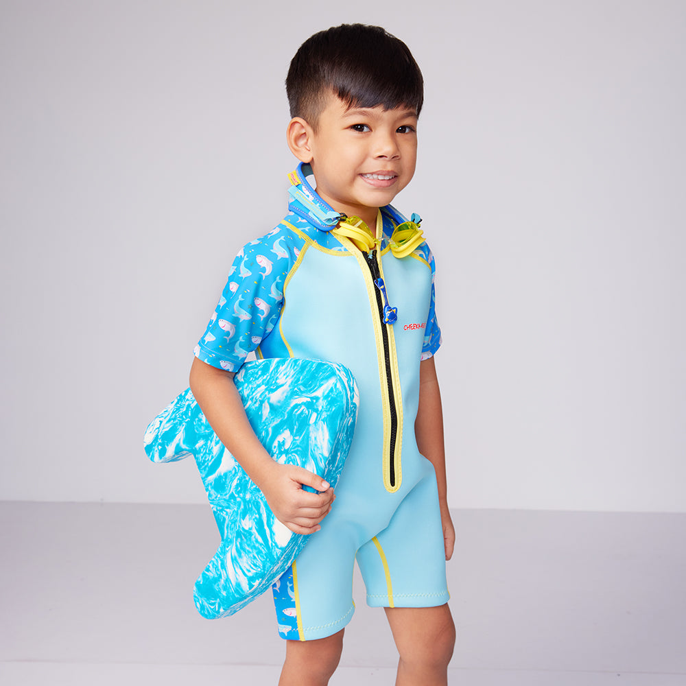 A kid carrying the EVA Foam Floating Swimming Kickboard