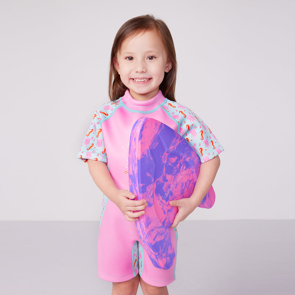A Girl Carrying Cheekaaboo's Pink Purple Foam Kickboard