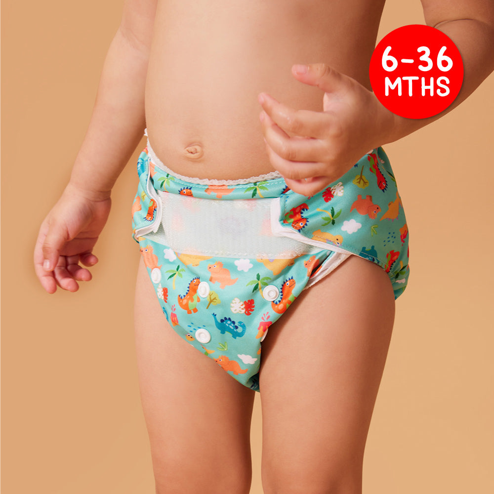 A Toddler Wearing Cheekaaboo's Waterproof Cloth Diaper in Dino Design