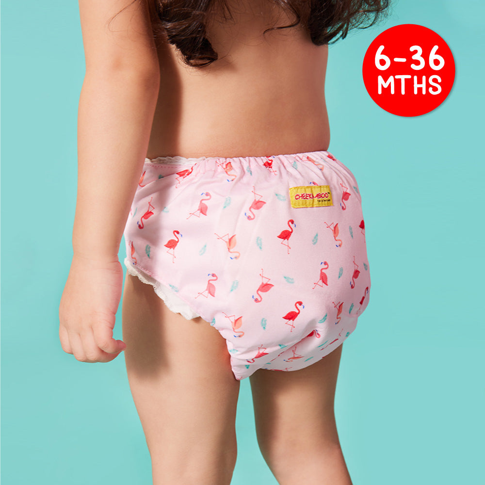 A Kid Wearing Cheekaaboo's Cloth Reusable Diapers in Flamingo Design
