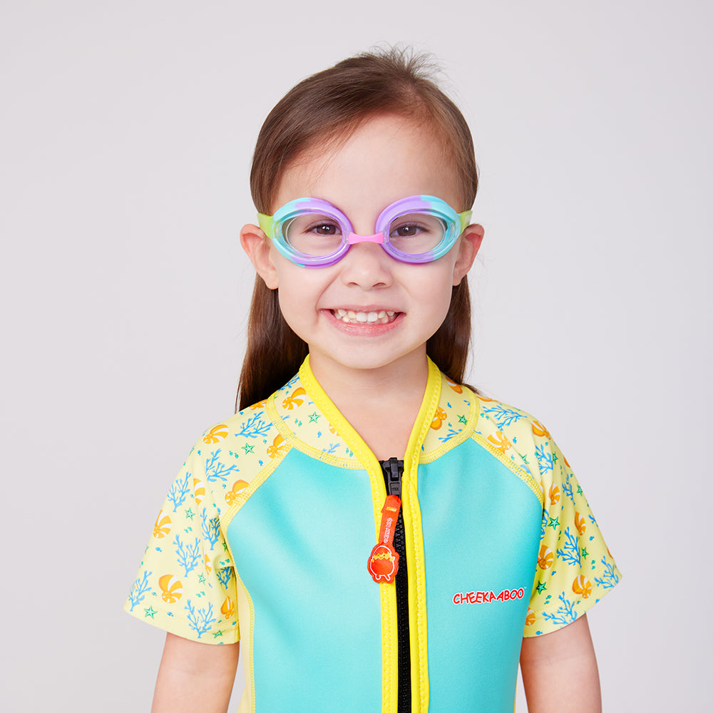 A Kid wearing the Adjustable Nose Bridge Swimming Goggles in Raibow Colors